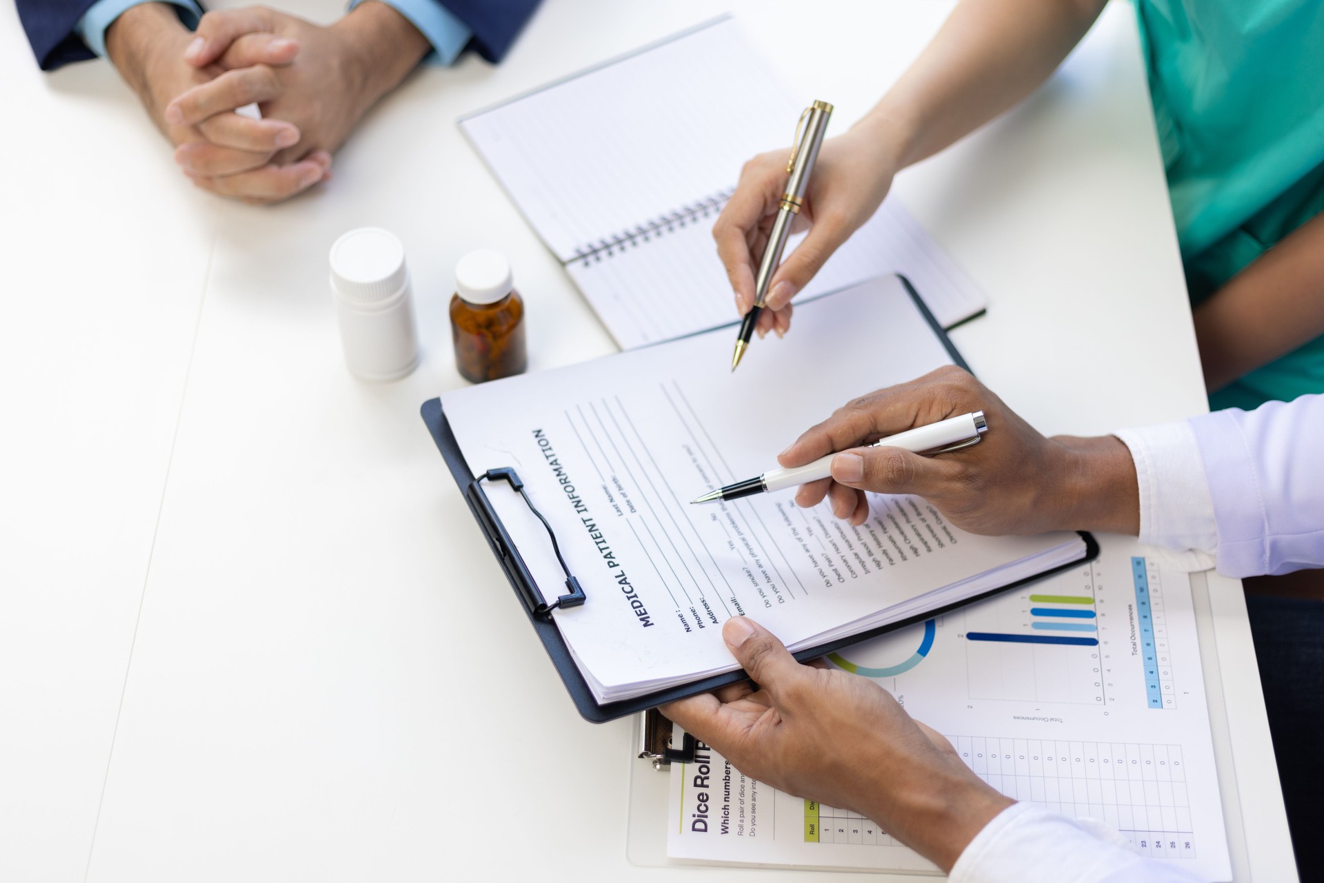 Group meeting of medical experts team is discussing the results of new drug treatments for patients. Healthcare staff discussing statistics, results of research and innovation.